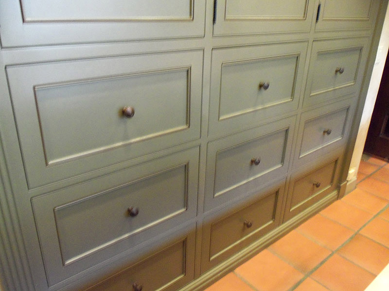 Drawers of kitchen island with maple distressed butcher block