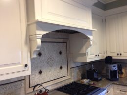 Custom kitchen hood with custom made corbels - San Marino residence