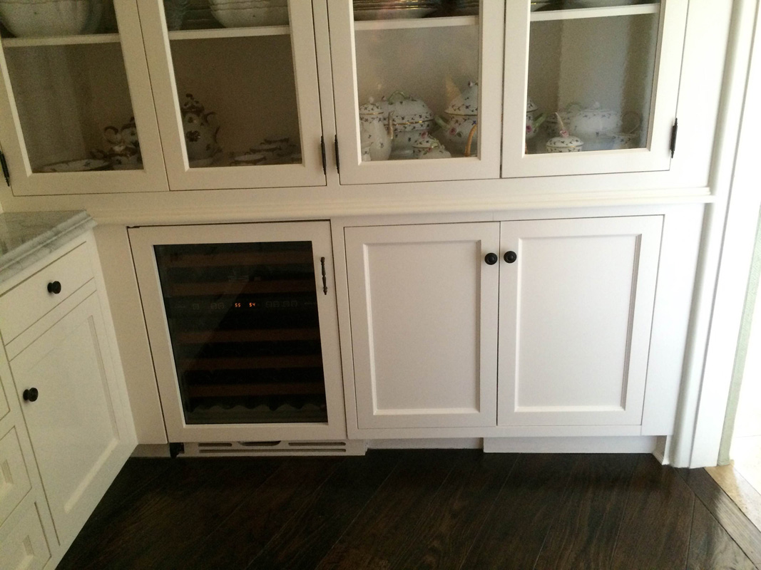 Kitchen cabinets with made top island glass doors - Holmby residence