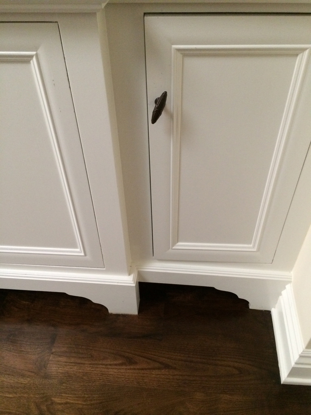 Custom linen closet with custom leg detail and beam & crown at ceiling