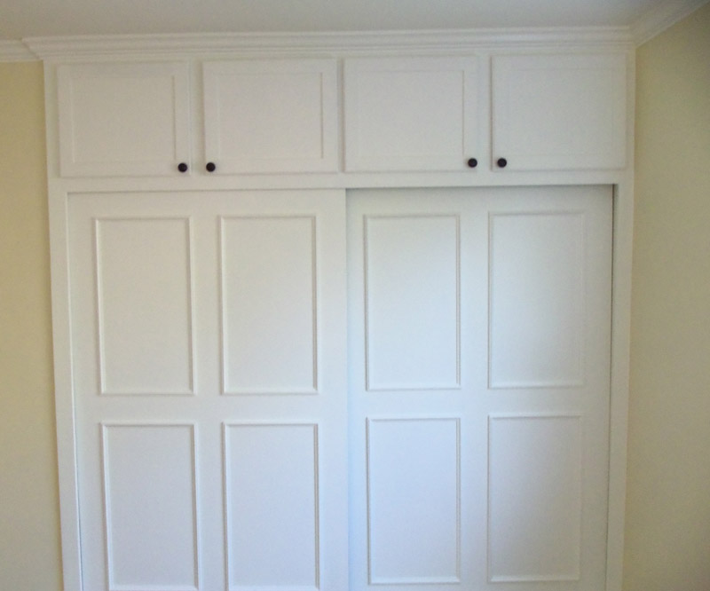 Built-in closet with by-pass doors