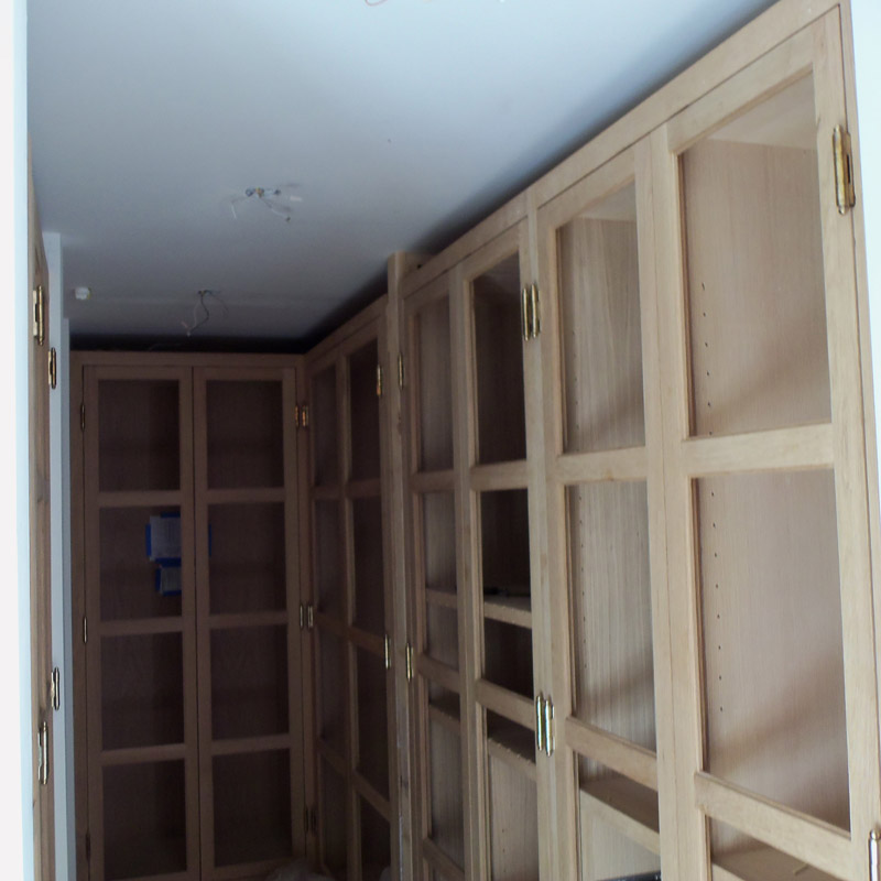 Closet cabinets in rift with oak before stains & glass