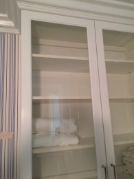 Linen closet with glass doors