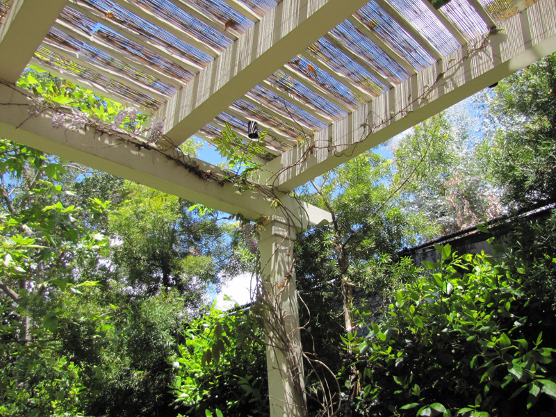 Pergola with trellis and outdoor fireplace alt view 1